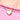 A close-up of a gold heart outlined in crystals pendant necklace with a mother of pearl white inlay