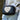 A black rectangular crossbody bag with a large cream-colored heart on the front.