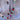 a picture of a colorful beaded necklace against a grey sweater 