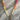 Multicolored beaded necklace with a gold clasp on a marble surface
